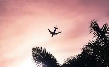 airplane under cloudy sky during daytime
