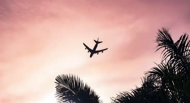 airplane under cloudy sky during daytime